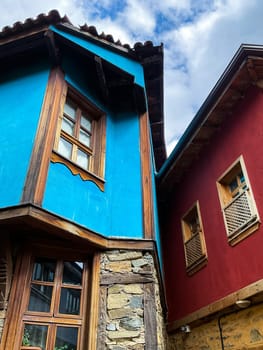 Traditional Ottoman house in blue and red. Old Ottoman village, UNESCO World Heritage Site. Old wooden mansion of Turkish architecture. Wooden Ottoman mansion