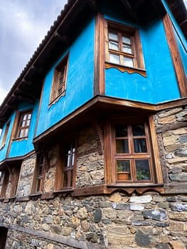 Traditional Ottoman house in blue and red. Old Ottoman village, UNESCO World Heritage Site. Old wooden mansion of Turkish architecture. Wooden Ottoman mansion