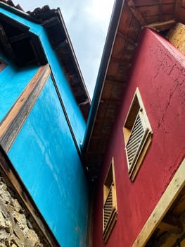 Traditional Ottoman house in blue and red. Old Ottoman village, UNESCO World Heritage Site. Old wooden mansion of Turkish architecture. Wooden Ottoman mansion