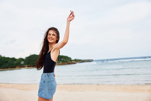 woman beach smiling sunrise sunset leisure lifestyle beauty travel female running summer freedom smile person young tan shore sea happy flight