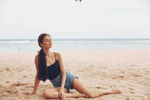 woman beach person sitting outdoor nature girl smile long summer water female hair beauty fashion sand vacation adult sea travel freedom tropical