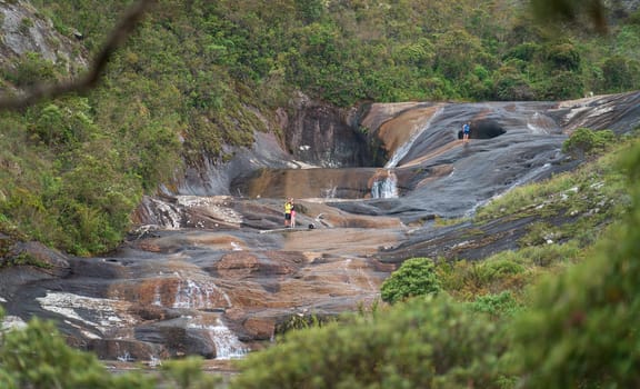 Tourists bravely pose for pictures in the Enchanted Valley of Caparao, risking it all for the perfect shot of the colorful rock pools that have been carved over millennia.