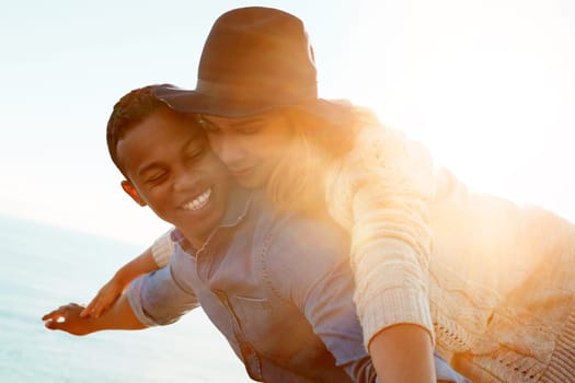 Surrender to the beauty of love. a happy young couple enjoying a piggyback ride outdoors