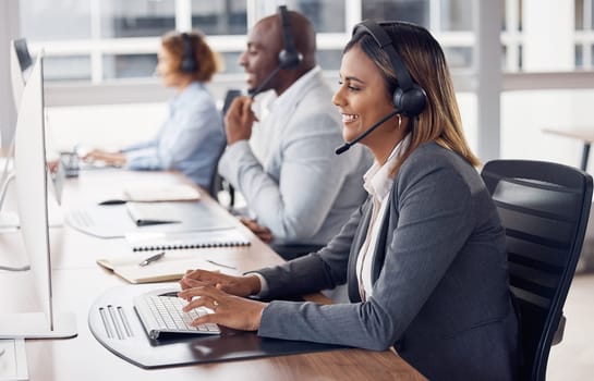 Call center woman, computer and typing with smile, reading and customer support with happiness at job. Indian telemarketing consultant, desktop pc and happy crm with communication in modern office.