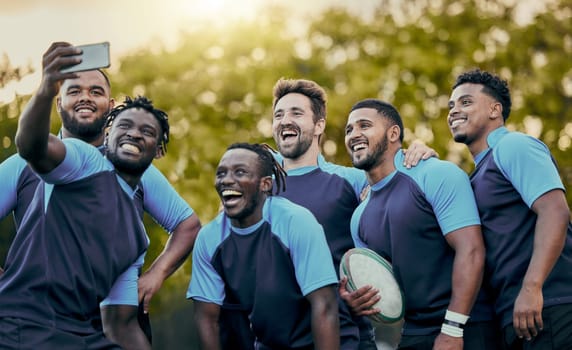 Rugby, team and sports selfie for profile picture, vlog or social media post together. Sporty man holding smartphone smiling in teamwork for group photo, memory or friendship outdoors.