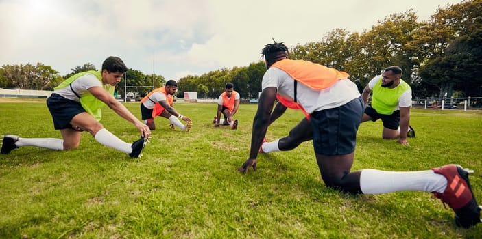 Sports, training and men outdoor for rugby on grass field with diversity team stretching as warm up. Athlete group together for fitness, exercise and workout for professional sport or teamwork energy.