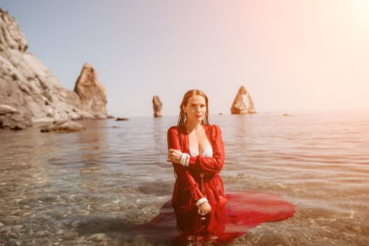 Woman travel sea. Happy tourist taking picture outdoors for memories. Woman traveler looks at the edge of the cliff on the sea bay of mountains, sharing travel adventure journey.