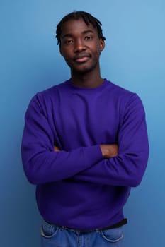 positive black american young guy with dreadlocks smiling.