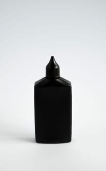 Mock up unbranded black bottle of finish line dry bicycle lubricant. Bicycle care, bicycle chain care