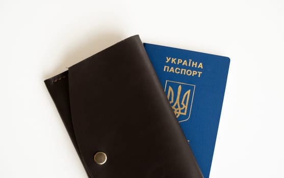 Ukrainian biometric passport id with a genuine leather wallet on a white background