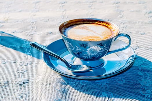 Milk tea or coffee with milk in vintage blue pattern cup