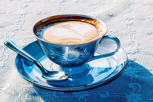 Milk tea or coffee with milk in vintage blue pattern cup