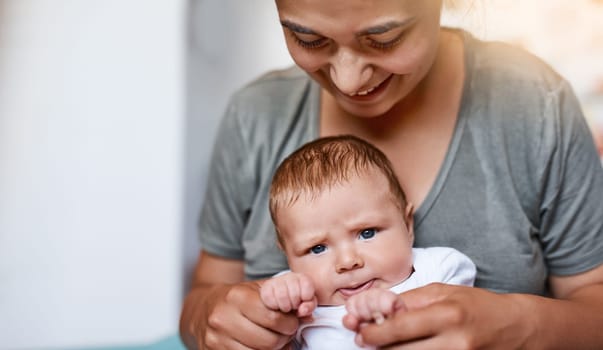 Babies bring so much love and joy into your life. a young woman bonding with her baby boy at home