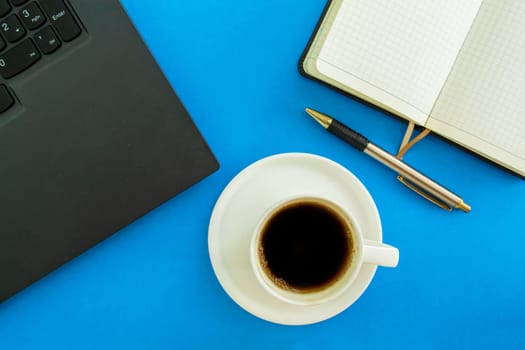 Desktop. Laptop, notepad and pen, coffee cup. Mockup diary. Business, freelancing, back to school.