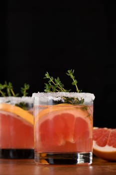 Pink Paloma with red grapefruit and tequila. The red grapefruit adds the perfect amount of sweetness, and the vibrant color of the juice makes this a great cocktail. Organic vegetarian drink.