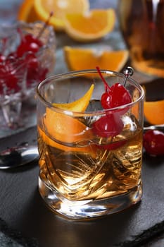 The Irish redhead. The cocktail is made from whiskey, grenadine syrup, soda water, lemon or lime juice, garnished with cherry garnish and orange zest, served in a scotch class with ice. An ideal aperitif before dinner.