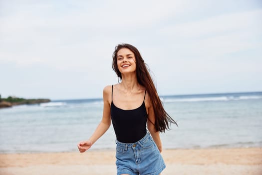 person woman ocean copy beach sea smiling summer active positive body young lifestyle freedom running shore smile water sunrise space travel sunset