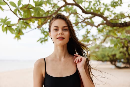 woman enjoyment beach nature water copy-space person walk freedom vacation summer ocean free sunset lifestyle smile sand sea holiday young sunlight