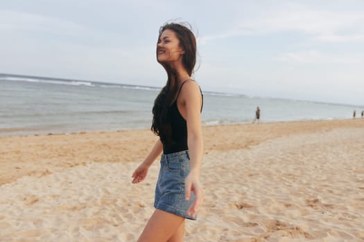 woman summer long happiness smiling enjoyment sunset walking lifestyle hair holiday vacation leisure walk ocean beach smile girl sand sea free female