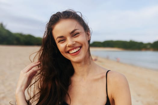 woman nature free girl walking sea leisure sand water sunlight copy-space female sunset vacation beach lifestyle ocean summer tropical walk smile