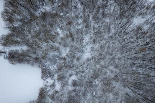 Aerial view of snowy mountain winter white landscape Vezzolacca , Emilia Romagna, Italy