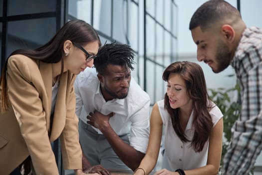 Ambitious smart employee speaks in a meeting and shares her opinion on a creative idea in a group briefing