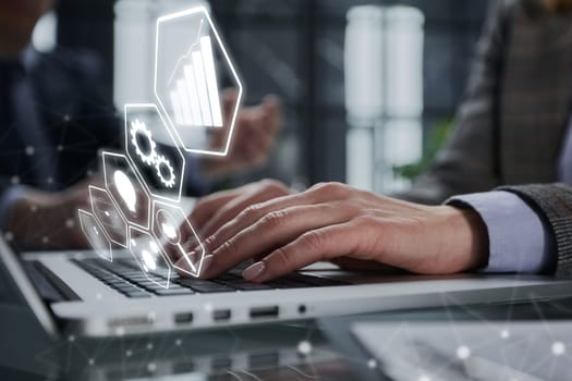 Close-up of male hands using laptop at office