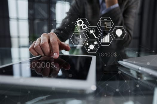 businessman pressing his finger on the screen of the digital tab