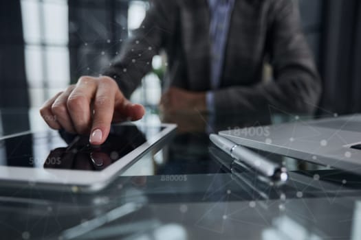 businessman pressing his finger on the screen of the digital tab