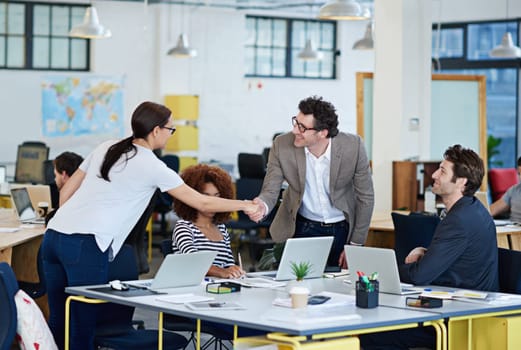 Youre team leader now. business people around a table