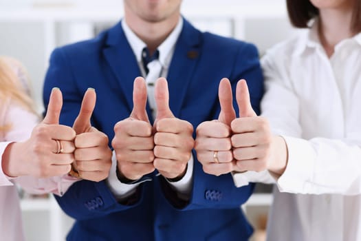 Group of people show OK or approval with thumb up during conference closeup. High level quality product serious offer excellent education mediation solution creative advisor participation concept