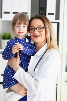 Little child with mother at pediatrician reception. Physical exam cute infant portrait baby aid healthy lifestyle ward round child sickness clinic test high quality and baby concept