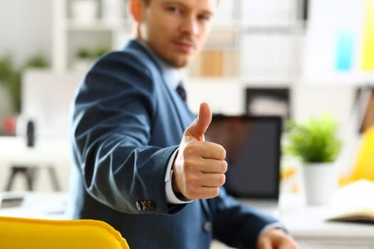 Male arm show OK or confirm during conference in office closeup. High level and quality product offer okay symbol expression perfect mediation solution happy client creative adviser participate
