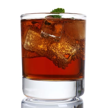 Cocktail whiskey cola with ice and mint in a glass isolated on white background