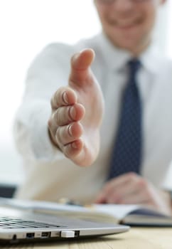 Smiling businessman pleased to meet you at office