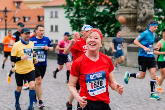 Prague, Czechia - 7th May 2023 - Runners of Prague Half marathon in the city streets.