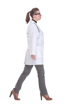 Full length portrait of medical doctor woman going sideways. Concept of medical help