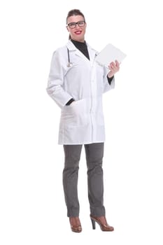 Full lenth portrait of a happy young doctor working with a tablet, on white background