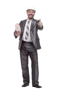 in full growth. smiling business man with drawings. isolated on a white background.