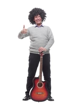 in full growth. cheerful man with a guitar. isolated on a white background.