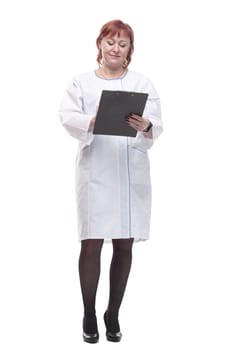 in full growth. competent female doctor with clipboard . isolated on a white background.