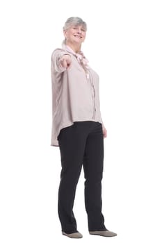 in full growth.smiling old lady pointing at you. isolated on a white background.