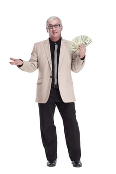 in full growth. happy intelligent man with banknotes. isolated on a white background.