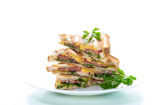 fried toasts stuffed with sausage, cheese and greens inside, isolated on white background.