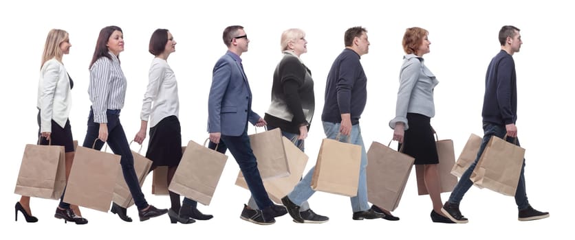 a group of people stand in line with shopping bags. isolated on white