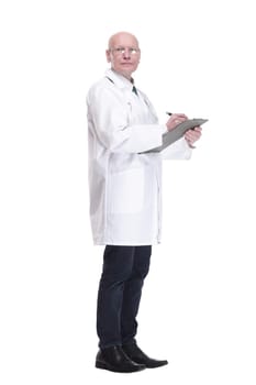 in full growth. male doctor writing a prescription for a patient. isolated on a white background.