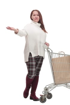 full-length. casual woman with shopping cart .isolated on a white background.