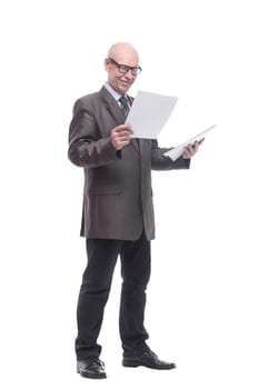 in full growth. business man with a stack of documents. isolated on a white background