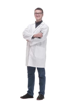 in full growth. confident male doctor with a stethoscope . isolated on a white background.