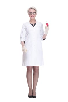 in full growth. female scientist with a laboratory flask looking forward . isolated on a white background.